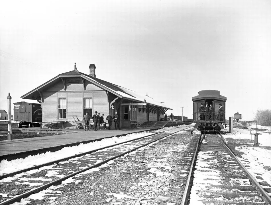Northern Pacific depot in Bozeman in winter, with passengers on the platform.