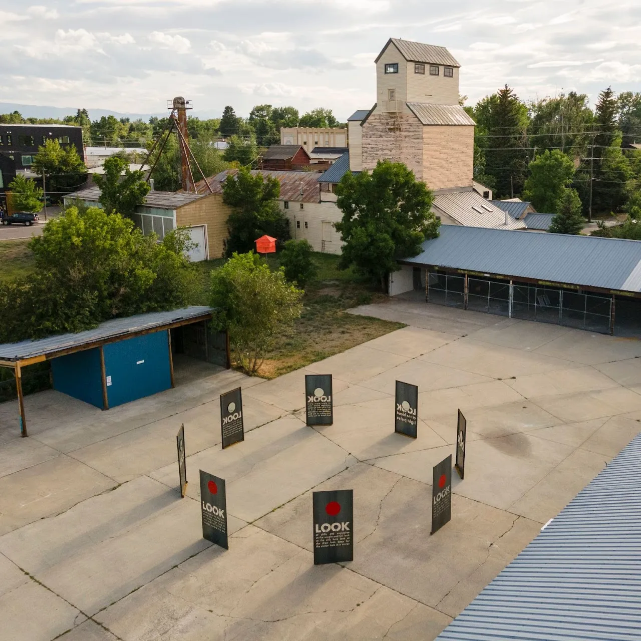 Art installation in the courtyard of the Historic Brewery District, with the grain elevator behind.
